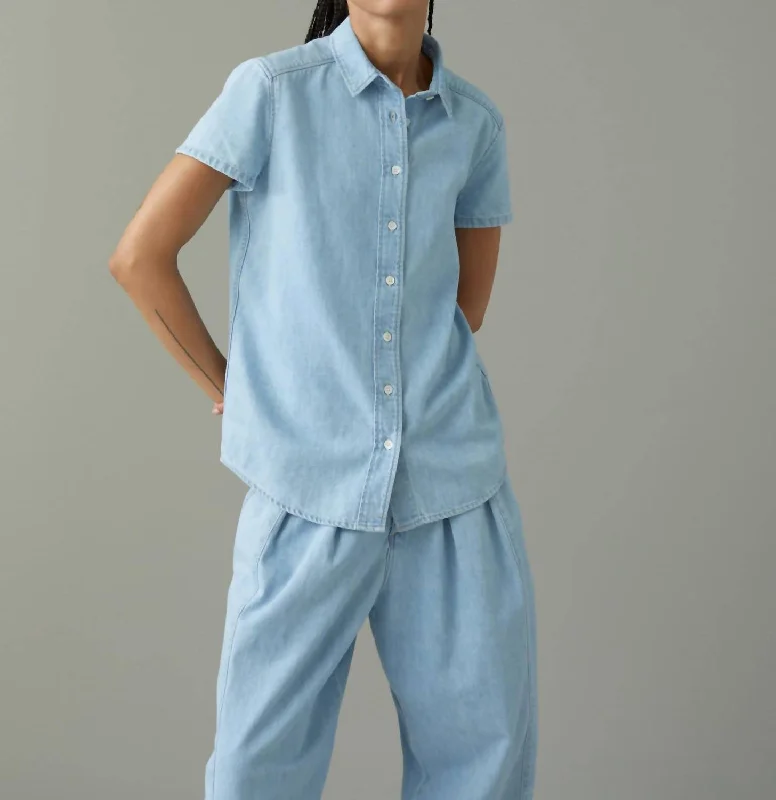 Denim with bootsA Better Blue Denim Blouse In Light Wash